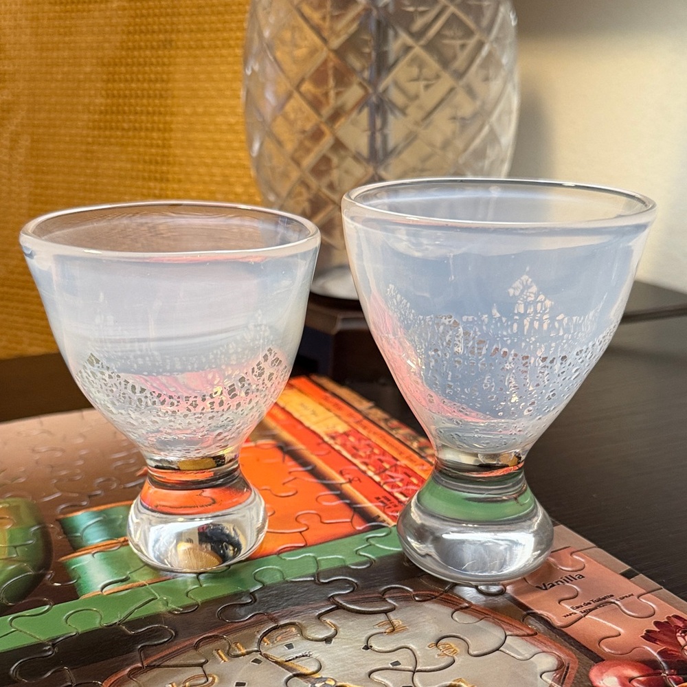 Two small glasses featuring an opalescent/milky glass w/ silver speckled pattern